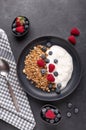 Healthy breakfast with baked granola and greek yogurt. Assorted fresh berries. Vertical photo Royalty Free Stock Photo