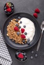 Healthy breakfast with baked granola and greek yogurt. Assorted fresh berries. Vertical photo Royalty Free Stock Photo