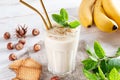 Healthy breakfast. Banana smoothie with cookies in a glass, fruits and cookies made of sunflower seeds, sesame and honey Royalty Free Stock Photo