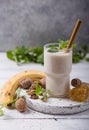 Healthy breakfast. Banana walnuts smoothie with collagen, coconut milk in glass jar Royalty Free Stock Photo