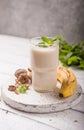 Healthy breakfast. Banana walnuts smoothie with collagen, coconut milk in glass jar Royalty Free Stock Photo