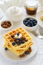 Healthy breakfast. Belgian waffles with butter, blueberry and nuts