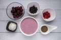 Healthy breakfast berry smoothie bowl with Blueberries, blackberries, chia seeds, raspberry and grounded coconut flakes. top view. Royalty Free Stock Photo