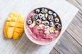 Healthy breakfast berry smoothie bowl topped with banana, granola Royalty Free Stock Photo