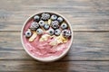 Healthy breakfast berry smoothie bowl topped with banana, granola, Blueberries and chia seeds with copy space Royalty Free Stock Photo