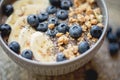 Healthy breakfast berry smoothie bowl topped with banana, granola, Blueberries and chia seeds with copy space Royalty Free Stock Photo