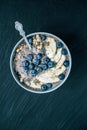 Healthy breakfast berry smoothie bowl topped with banana, granola, Blueberries and chia seeds with copy space Royalty Free Stock Photo