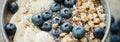 Healthy breakfast berry smoothie bowl topped with banana, granola, Blueberries and chia seeds with copy space Royalty Free Stock Photo