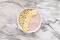 Healthy breakfast berry smoothie bowl topped with banana, muesli and chia seeds. Top view. Royalty Free Stock Photo