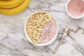 Healthy breakfast berry smoothie bowl topped with banana, muesli and chia seeds. Top view. Royalty Free Stock Photo