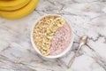 Healthy breakfast berry smoothie bowl topped with banana, muesli and chia seeds. Top view. Royalty Free Stock Photo