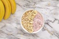 Healthy breakfast berry smoothie bowl topped with banana, muesli and chia seeds. Top view. Royalty Free Stock Photo