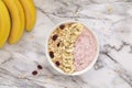 Healthy breakfast berry smoothie bowl topped with banana, muesli and chia seeds. Top view. Royalty Free Stock Photo