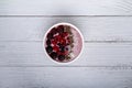 Healthy breakfast berry smoothie bowl topped with Blueberries, blackberries, chia seeds, raspberry and grounded coconut flakes. Royalty Free Stock Photo