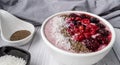 Healthy breakfast berry smoothie bowl topped with Blueberries, blackberries, chia seeds, raspberry and grounded coconut flakes. Royalty Free Stock Photo