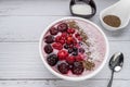 Healthy breakfast berry smoothie bowl topped with Blueberries, blackberries, chia seeds, raspberry and grounded coconut flakes. Royalty Free Stock Photo