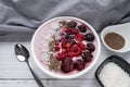 Healthy breakfast berry smoothie bowl topped with Blueberries, blackberries, chia seeds, raspberry and grounded coconut flakes. Royalty Free Stock Photo