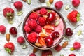 Healthy breakfast berry smoothie bowl topped with raspberry, strawberry, cherry, chia and pumpkin seeds Royalty Free Stock Photo