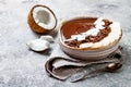 Healthy breakfast bowl. Chocolate banana smoothie bowl with coconut flakes, granola, banana slices