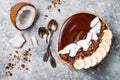 Healthy breakfast bowl. Chocolate banana smoothie bowl with coconut flakes, granola, banana slices Royalty Free Stock Photo