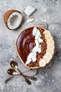 Healthy breakfast bowl. Chocolate banana smoothie bowl with coconut flakes, granola, banana slices Royalty Free Stock Photo