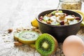 Healthy breakfast. bowl of homemade oatmeal with fruits, berries, nuts and egg Royalty Free Stock Photo