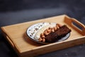 Healthy breakfast bowl on the kitchen table, selective focus. Rye bread, banana, hazelnut, chocolate muesli and yogurt Royalty Free Stock Photo