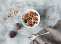 Healthy breakfast. Bowl of oat granola with yogurt, fresh blueberries and figs Royalty Free Stock Photo