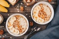 Healthy breakfast bowl. oatmeal with banana, walnuts, chia seeds and honey