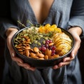 Healthy breakfast bowl. Yogurt, granola, seeds, fresh and dry fruits and honey bowl in woman& x27;s hands.Detox food Royalty Free Stock Photo