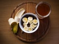 Healthy breakfast, cereals bowl with honey and banana