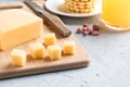 Healthy Breakfast Cheese on a Board cut into cubes Juice Peanuts waffle Cookies Selective focus.