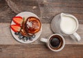 Healthy breakfast. Coffee and delicious pancakes, with fresh berries on wooden table Royalty Free Stock Photo