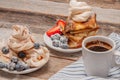 Healthy breakfast. Coffee and delicious pancakes, with fresh berries on wooden table Royalty Free Stock Photo