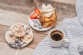 Healthy breakfast. Coffee and delicious pancakes, with fresh berries on wooden table Royalty Free Stock Photo