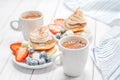 Healthy breakfast, coffee and homemade pancakes with fresh berries Royalty Free Stock Photo