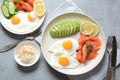 Healthy breakfast concept, fried eggs, avocado and smoked salmon