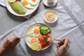 Healthy breakfast concept, fried eggs, avocado and smoked salmon