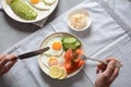 Healthy breakfast concept, fried eggs, avocado and smoked salmon