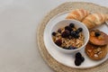 Healthy breakfast concept. Granola with berries, croissants and Royalty Free Stock Photo