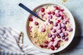 Healthy breakfast concept. Oatmeal bowl with berries, chia and hemp seeds, top view Royalty Free Stock Photo