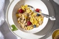 Healthy breakfast with corn flakes, berries and milk on white background. top view Royalty Free Stock Photo