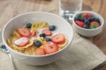 Healthy breakfast with corn flakes and berries in white bowl Royalty Free Stock Photo