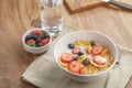 Healthy breakfast with corn flakes and berries in white bowl Royalty Free Stock Photo
