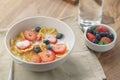 Healthy breakfast with corn flakes and berries in white bowl Royalty Free Stock Photo