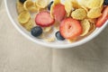 Healthy breakfast with corn flakes and berries in white bowl Royalty Free Stock Photo