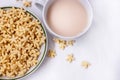 A healthy Breakfast of corn flakes, milk and tea on a white table Royalty Free Stock Photo