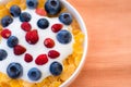 Healthy breakfast  - Cornflakes with bilberries, raspberries and yogurt Royalty Free Stock Photo