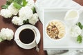 Healthy breakfast. Cup of black coffee, homemade oatmeal granola and nuts. Top view.