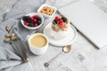 Healthy Breakfast Cup of Coffee Greek Yogurt with Homemade Granola, Berries, Raspberries and Blackberries Work Laptop Royalty Free Stock Photo